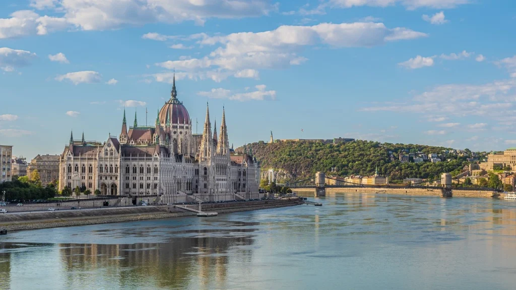 Budapest Parliament and Danube River view with Gellért Hill in the background